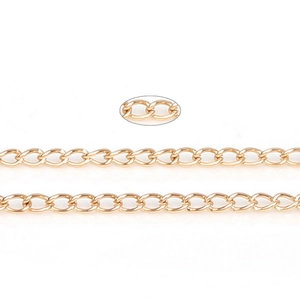 Macro detail of gold-plated metal chain links for DIY jewelry making and necklace crafts