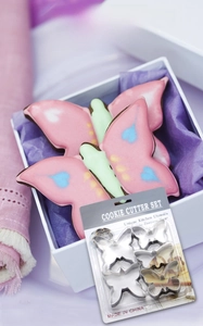 Detail of butterfly cookie cutters set made of stainless steel with finished pastries