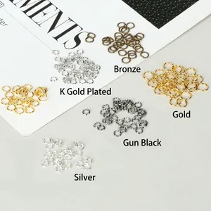 Assorted metal open jump rings in gold, silver, and bronze for DIY jewelry making