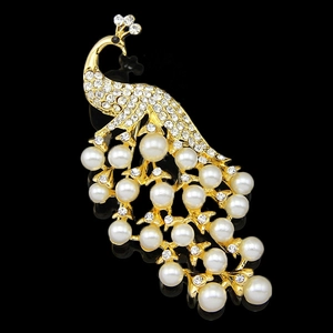 Exquisite 18k gold peacock brooch with white pearls and sparkling rhinestones on black base