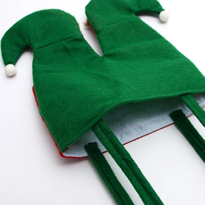 Christmas elf candy bag in green felt with white pom poms for festive holiday party decor