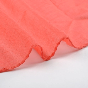 Coral red cotton linen scarf with soft texture and rolled hem edges for women