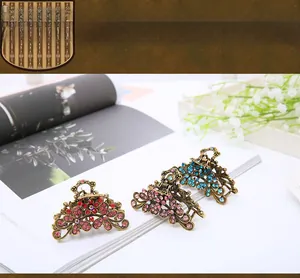 Detailed macro view of vintage bronze hair claws set with colorful rhinestones
