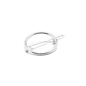Minimalist silver geometric circular hair clip with spring clip on white background