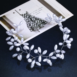 Elegant bridal headband with white pearls and silver wire vines for wedding photography