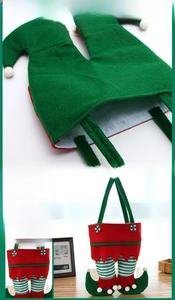 Detail of Christmas elf gift bag featuring festive striped leggings and green boots