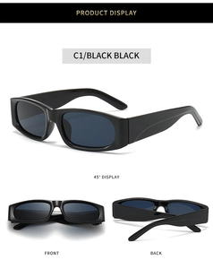 Detail view of retro small rectangle sunglasses with black thick frames and dark lenses