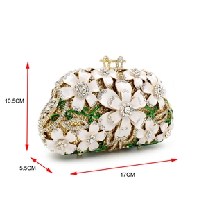 Detail view of crystal evening clutch with 17x10.5x5.5cm size markings and floral accents