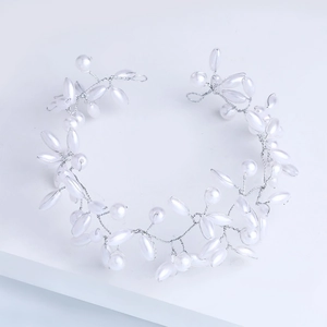 Elegant bridal headband with white pearls and rhinestones for wedding photography