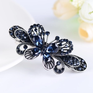 Silver alloy bow-knot hair clip with dark blue rhinestones and hollow leaf texture