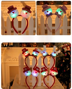 Detail of LED Christmas headbands with glowing Santa Claus, Snowman and Reindeer characters