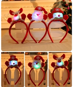 Detailed close-up showing LED glowing Christmas headbands with Santa and Reindeer designs
