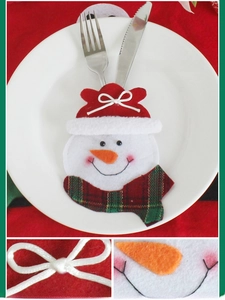 Detail of Christmas snowman cutlery holder with red scarf and embroidery on felt