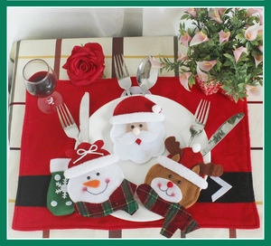 Round face style Christmas cutlery holders featuring Santa, Snowman and Reindeer characters