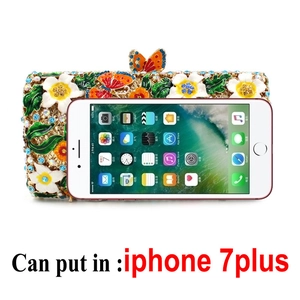 Luxury floral evening clutch with colorful rhinestones shown fitting an iPhone 7 Plus