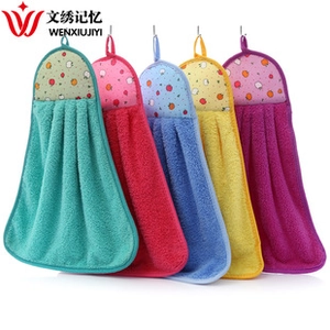 Detailed view of 5-piece coral fleece hand towel set with fruit embroidery and hanging loops