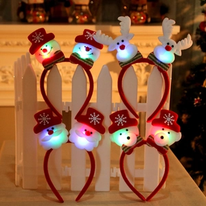 Set of 8 festive light-up Christmas headbands featuring Santa, Reindeer and Snowman