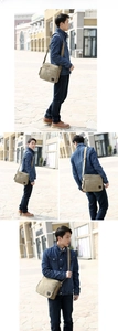 Outdoor lifestyle view of khaki canvas crossbody bag with multiple zipper pockets
