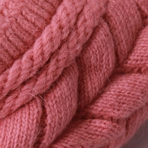 Macro di tessuto a trecce rosa in maglia spessa con morbida trama in pelo di coniglio