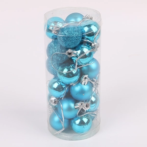 Detailed view of blue Christmas ball ornaments in matte and glitter finishes in a tube