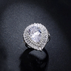 Elegant silver teardrop zircon cocktail ring with pear-cut center and halo setting