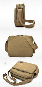 Detail view of khaki canvas messenger bag showing multiple zipper pockets and adjustable strap