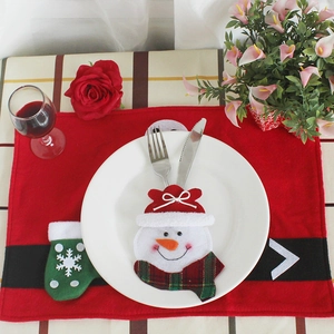 Christmas table decor set with Santa Claus placemat and snowman cutlery holder