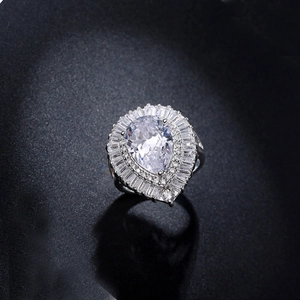 Pear cut teardrop zircon ring with halo baguette diamonds on silver plated band