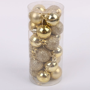 Golden Christmas ball ornaments set in cylindrical packaging featuring glitter and matte finishes