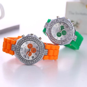 Close-up of Geneva silicone watches in orange and green with rhinestone bezels