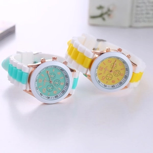 Detail view of Geneva silicone watches in mint green and yellow with rose gold finish