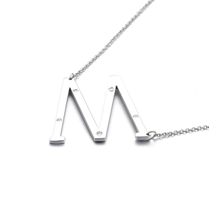 Polished silver M-letter pendant necklace with sparkling diamonds on a sleek steel chain