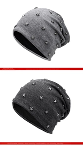 Detail view of light and dark grey beanies with silver star rivets and crystal studs