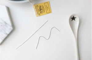 Detail of S925 sterling silver box chain earrings featuring minimalist long threader design