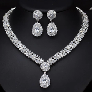 Macro detail of silver bridal jewelry set with AAA cubic zirconia on black background