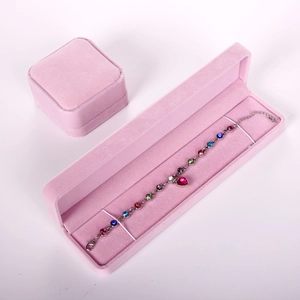 Pink velvet jewelry gift boxes showcasing a multi-colored crystal bracelet display