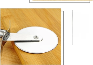 Macro detail of high-hardness stainless steel pizza cutter wheel slicing on wood