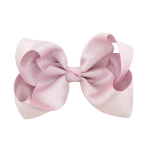 Elegant large pink satin bow hair clip with textured fabric for kids and women