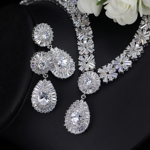 Detailed view of teardrop bridal jewelry set with cubic zirconia on black leather