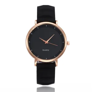 Slim silicone watch with rose gold case and black dial showing modern minimalist style