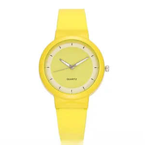 Detailed macro view of the minimalist yellow quartz watch with a silicone strap