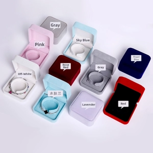 Detailed top view showing velvet jewelry boxes in various colors with necklace inserts