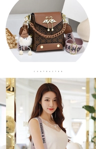 Detail of crossbody bag with floral pattern, golden swan clasp, and wide fabric strap