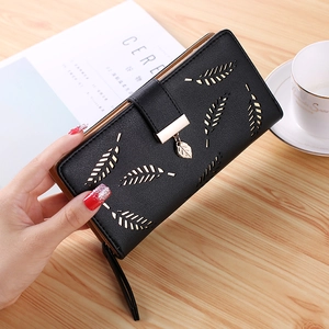 Elegant long black women's wallet with laser-cut leaf pattern and gold metal clasp