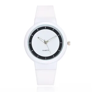Macro shot of minimalist white silicone sports watch with black inner dial and quartz movement