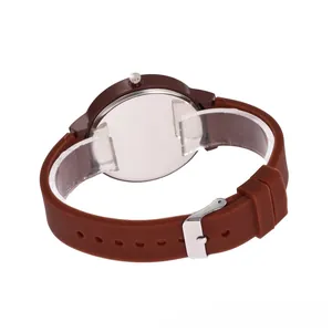 Detailed back view of brown silicone sports watch with polished silver metal case back