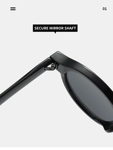Detailed close-up of secure metal hinge on oval sunglasses with polished black frames