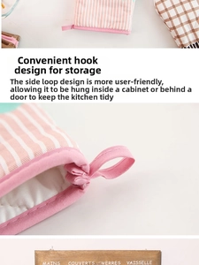 Detail showing the pink hanging loop and thick insulation of the plaid oven mitt