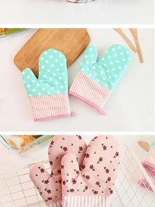 Detail of pastoral style checkered thick oven mitts with mint green dots and floral patterns