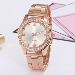 Detailed close-up of rose gold quartz watch with rhinestone bezel and Roman numeral dial